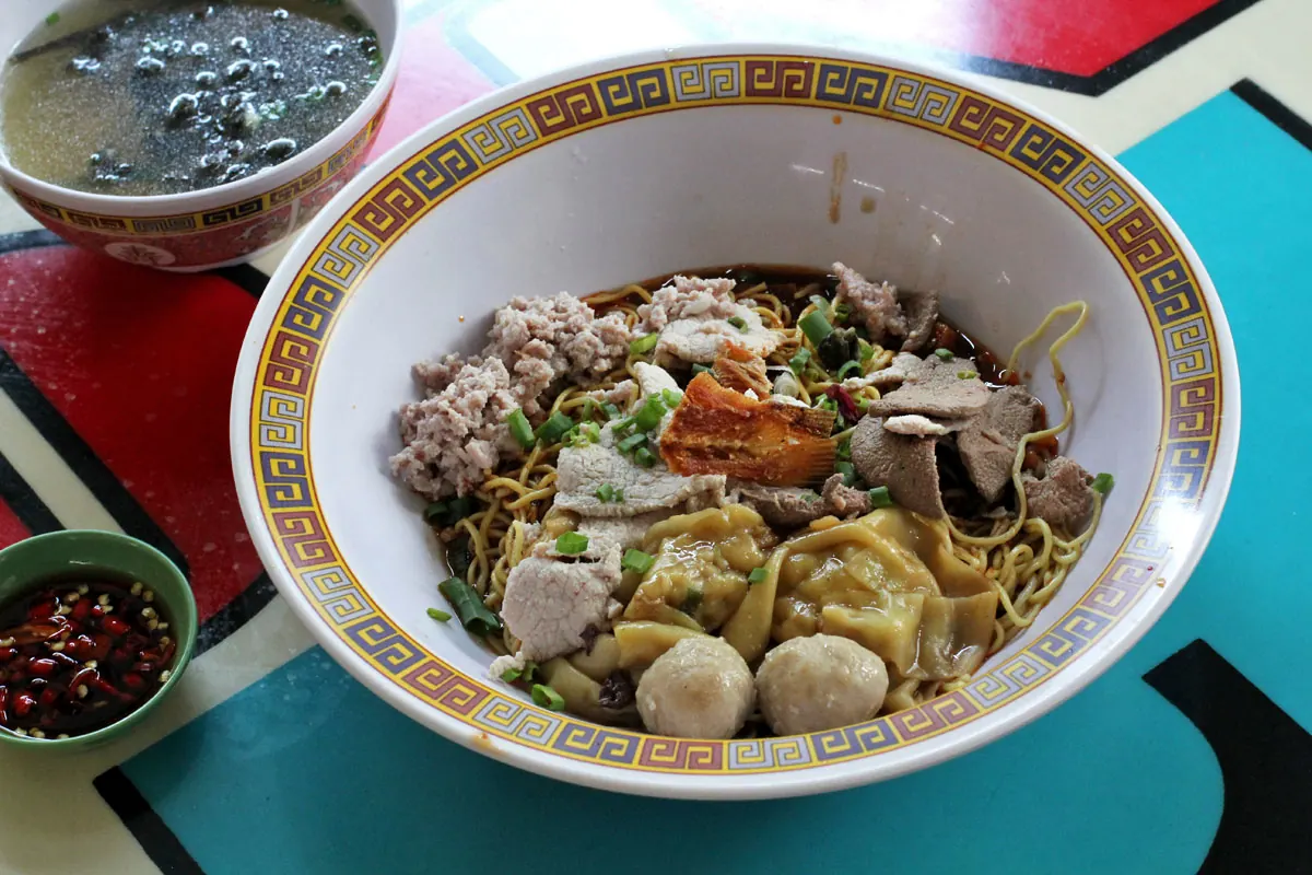Dry bak chor mee with minced pork, meatballs, dumplings, noodles and soup